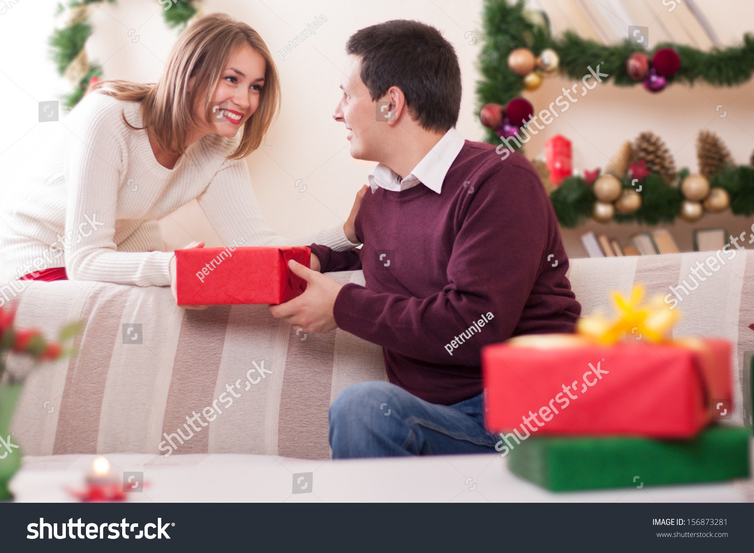 Best ideas about Christmas Gift Ideas For Young Couples
. Save or Pin Young Couple Exchanging Christmas Gift Stock Now.