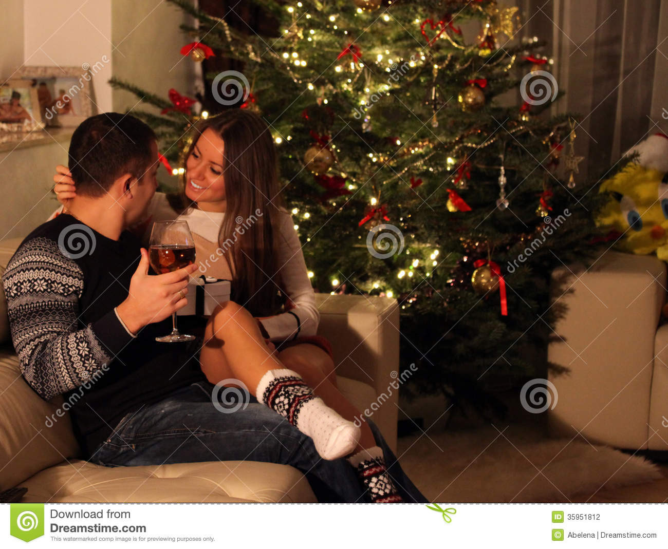 Best ideas about Christmas Gift Ideas For Young Couples
. Save or Pin Young Couple With Gifts In Front Christmas Tree Stock Now.