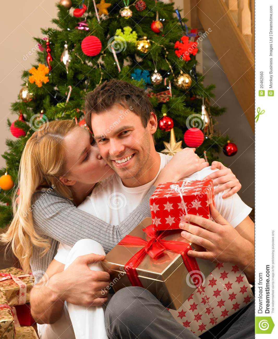 Best ideas about Gift Ideas For Young Couples
. Save or Pin Young Couple With Gifts In Front Christmas Tree Stock Now.