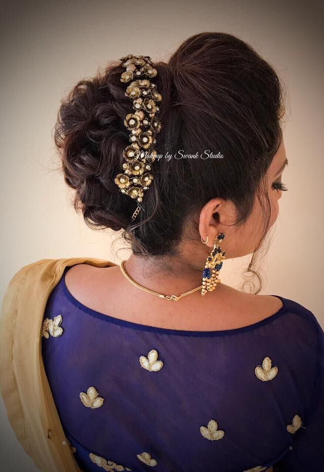 Indian Bun Hairstyles For Long Hair
 Bridal updo for reception by Swank South Indian bride