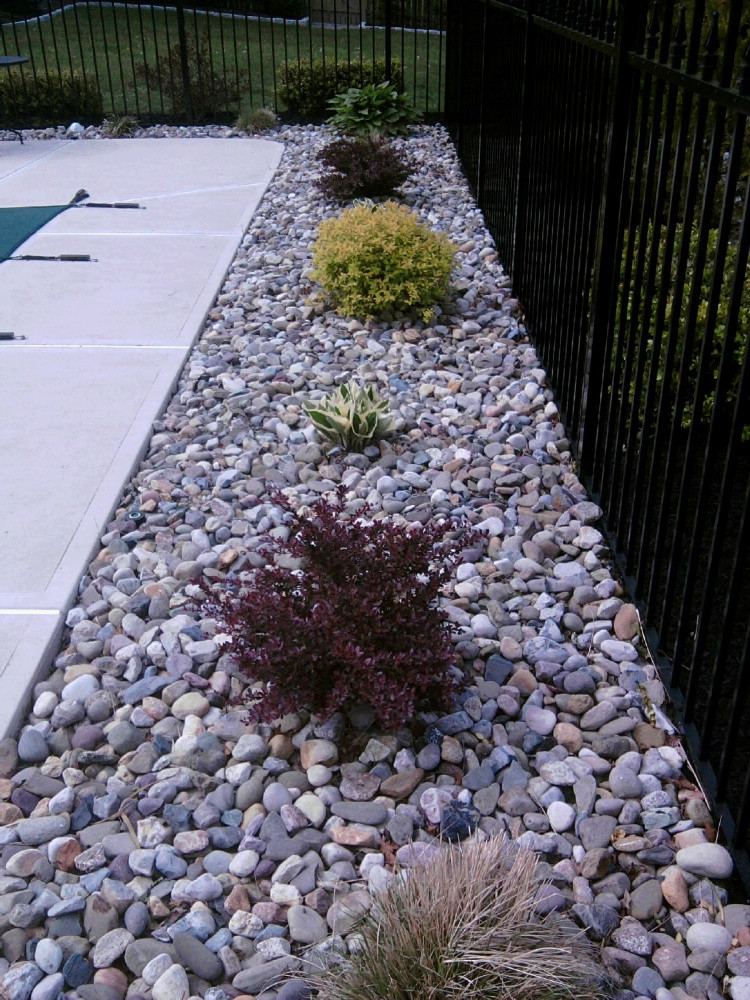 Best ideas about River Rock Landscape
. Save or Pin Refreshing a Swimming Pool Landscape All About The House Now.