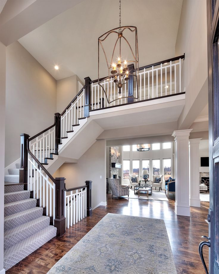 Best ideas about House With Staircase
. Save or Pin Entry curved staircase open floor plan overlook from Now.