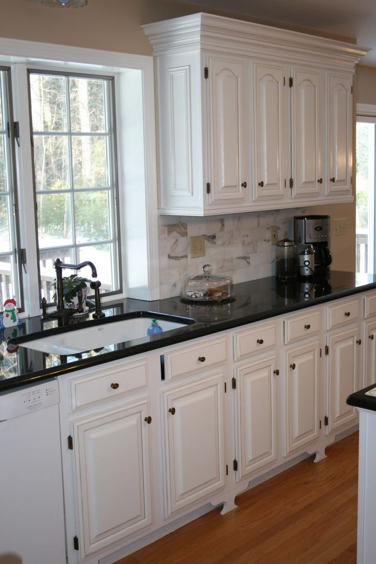 Best ideas about Kitchen Cabinets And Countertops
. Save or Pin White Kitchens with Black Countertops Now.