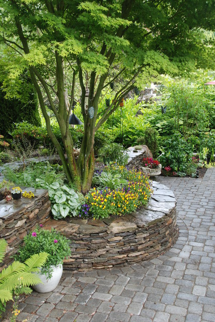 Best ideas about Landscape Around Trees
. Save or Pin Stacked Stone Walls and Paver Patio Traditional Now.