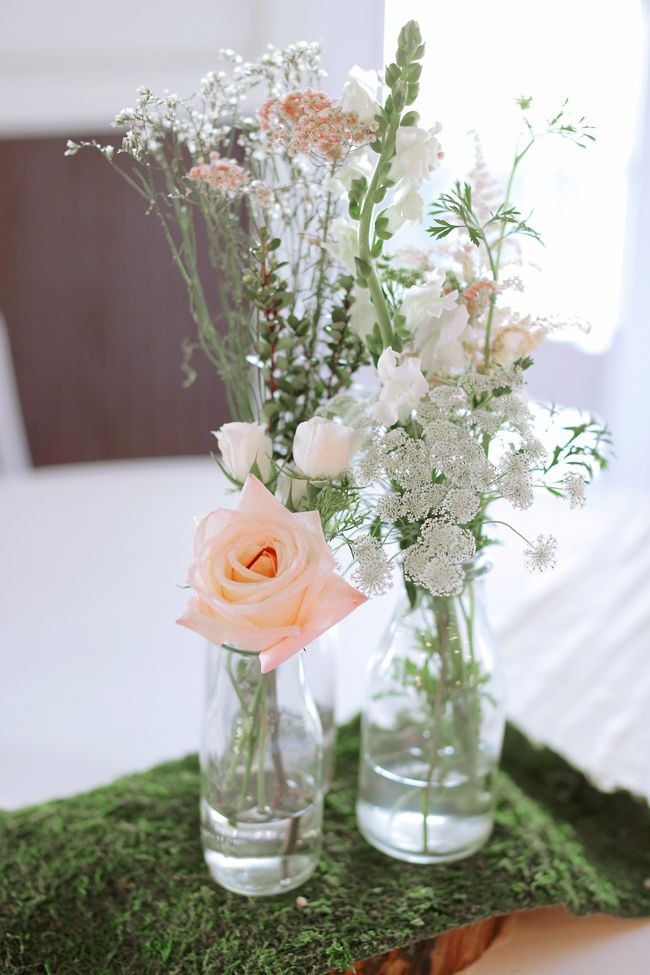 Best ideas about Simple Wedding Centerpieces DIY
. Save or Pin Simple Bottle Centerpiece With Roses on Moss Now.