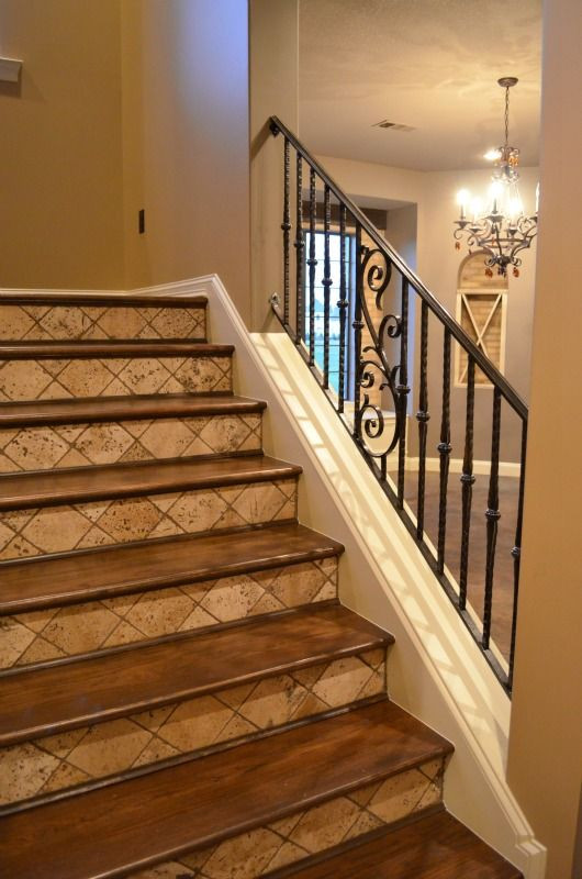 Best ideas about Tile On Stairs
. Save or Pin Iron railing tumbled tile risers and stained wood treads Now.