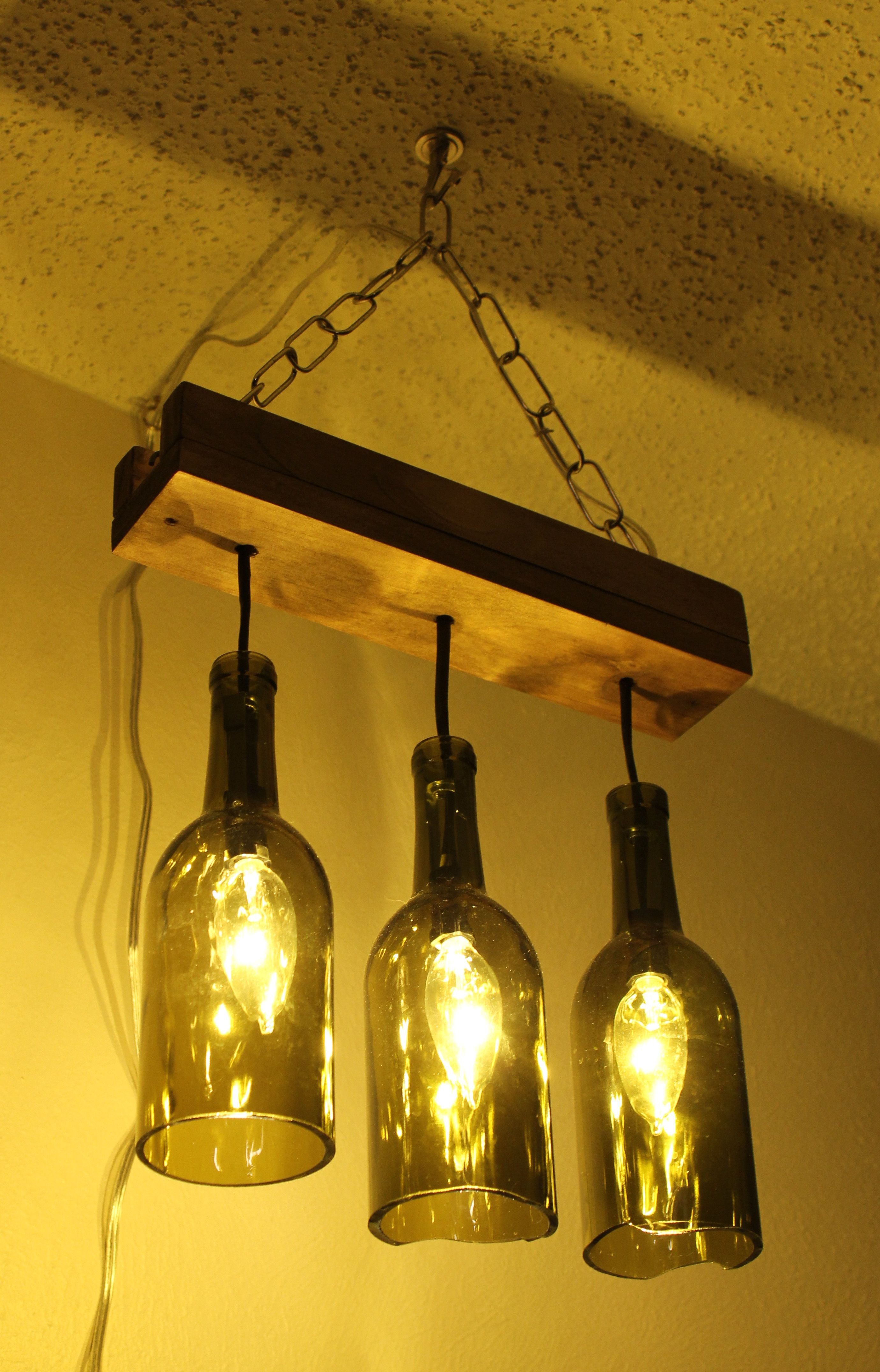Best ideas about Bottle Lights DIY
. Save or Pin Making a wine bottle chandelier Now.